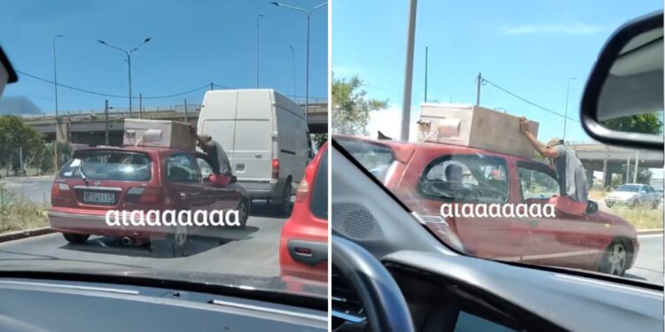 Εικόνα σοκ: Μεταφέρουν ψυγείο, χωρίς να είναι δεμένο! Αντί σχοινιού το κρατάει ένας κρεμασμένος από το παράθυρο!